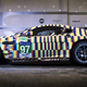 Illustration for article titled Aston Martins Trippy New Art Car Comes From Certified Art Car Badass